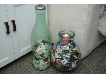 Two Glass Containers Filled With Matchbooks