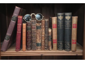 Antique Book Collection With Vintage Round Spectacles