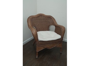 Brown Wicker Armchair With Scalloped Back