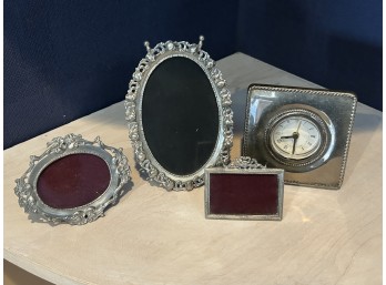 Group Of Silver-Tone Picture Frames And Small Desk Clock