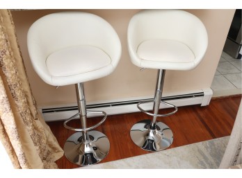 Pair Of White Upholstered Hydraulic Bar Stools With Chrome Bases