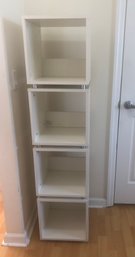 Four White Stackable Storage Boxes