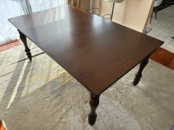 Dark Brown Wood Extendable Dining Table With Ornate Turned Legs