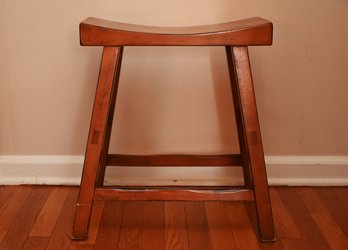 Low  Wooden Stool With A Curved Seat