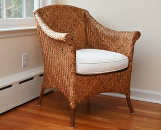 Woven Rattan Armchair With A Classic Barrel-back Design