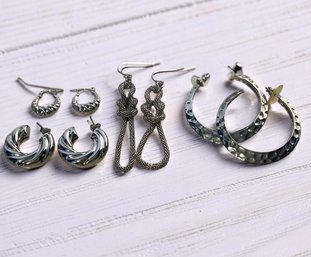 Four Silver-tone Earrings