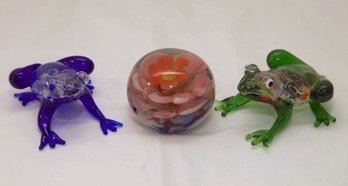 Three Art Glass Paperweights And Frog Figurines
