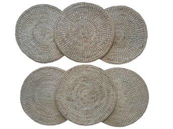 Six Crate & Barrel Round Rattan Placemats
