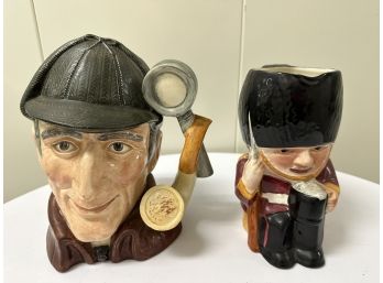 Pair Of Figural Drinking Jugs