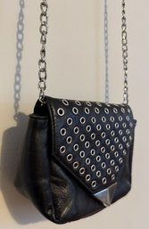 Edgy Black Leather Crossbody Bag With Silver Eyelet Accents