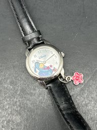 Disney Women's WTP053 Eeyore Black Leather Strap With Flower Charm Watch By SII/Seiko, 7.5', Needs Battery