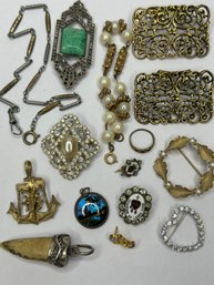Vintage Jewelry Lot With Amulets, Brooches, And Gold Toned Filigree Shoe Clips