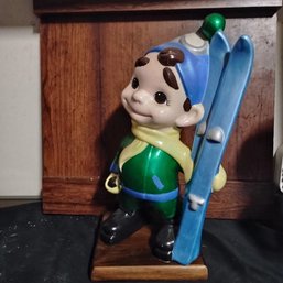Vintage Ceramic Figurine Of 'Atlantic Mold Smiley Boy' Depicted As A Skier, Likely Produced In The 1970(NM)
