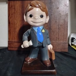 Vintage Ceramic Figurine Of 'Atlantic Mold Smiley Boy' Depicted As A Salesman Likely From 1970s (NM)