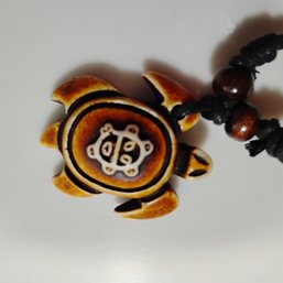 Unisex  Resin Turtle Pendant Necklace Features Tribal Or Hawaiian-inspired Carvings (NM)