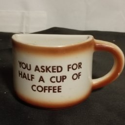 Vintage Ceramic Mug Is Designed As A Novelty Item With A Flat Side 'you Asked For Half A Cup Of Coffee' (NM)