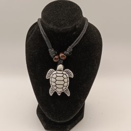 White Resin Carved Tribal Style Sea Turtle Pendant On A Black Adjustable Cord Necklace With Wooden Beads (NM)