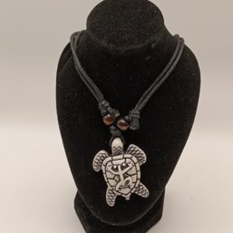White Resin Carved Tribal Style Sea Turtle Pendant On A Black Adjustable Cord Necklace With Wooden Beads (NM)