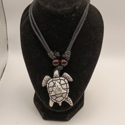 White Resin Carved Tribal Style Sea Turtle Pendant On A Black Adjustable Cord Necklace With Wooden Beads (NM)
