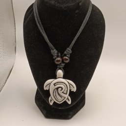 White Resin Carved Tribal Style Sea Turtle Pendant On A Black Adjustable Cord Necklace With Wooden Beads (NM)