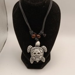White Resin Carved Tribal Style Sea Turtle Pendant On A Black Adjustable Cord Necklace With Wooden Beads (NM)