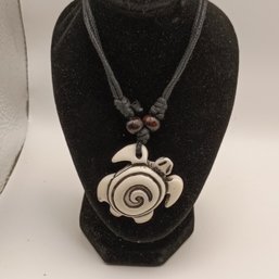 White Resin Carved Tribal Style Sea Turtle Pendant On A Black Adjustable Cord Necklace With Wooden Beads (NM)