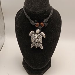 White Resin Carved Tribal Style Sea Turtle Pendant On A Black Adjustable Cord Necklace With Wooden Beads (NM)