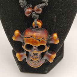 Brown Resin Skull And Crossbones Necklace Pendant On An Adjustable Black Cord With Wood Beads  (NM)