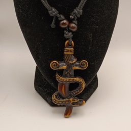 Brown Resin Serpent And Sword Necklace Pendant On An Adjustable Black Cord With Wood Beads (NM)