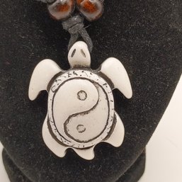 White Resin Carved Tribal Style Sea Turtle Pendant On A Black Adjustable Cord Necklace With Wooden Beads (NM)