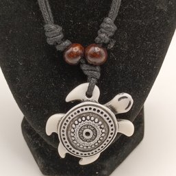 White Resin Carved Tribal Style Sea Turtle Pendant On A Black Adjustable Cord Necklace With Wooden Beads (NM)