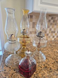 Lot Of Four Oil Lamps With Oil Refill