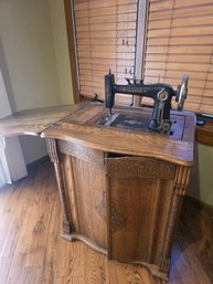 Brunswick Antique Sewing Machine In Cabinet