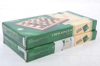 2 New Chess Sets - With Folding Board That Also Stores Chess Pieces