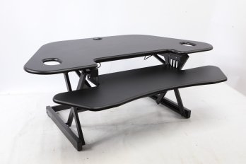 Adjustable Stand Up Desk Measures Approximately 44x22' Black Used In Nice Condition.