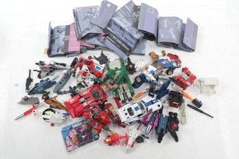 Lot Of Transformers Vehicles And Weapons