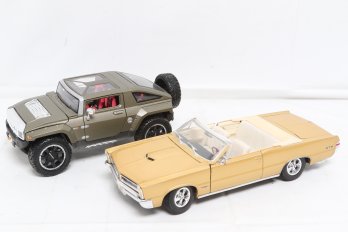 Two 1:18 Scale Collectible Car Models