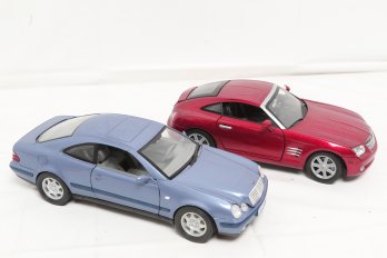 Two 1:18 Scale Collectible Car Models