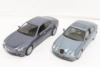 Two 1:18 Scale Collectible Car Models