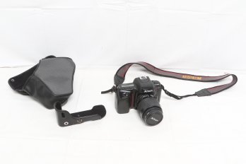 Nikon N50 35mm SLR Film Camera Together With Nikon AF Nikkor 35-80mm F/4-5.6 D Autofocus  Lens  And Cover