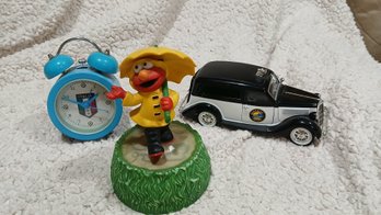 Lot: Italia Clock, Sesame Street Elmo Music Box, Kentucky State Police - Unique Replicas - 1935  Ford