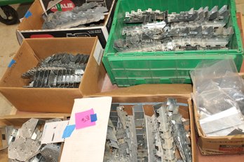 Multiple Boxes, Sizes, Types Of Simpson Styled Hangers On Pallet And Rolling Floor Cart