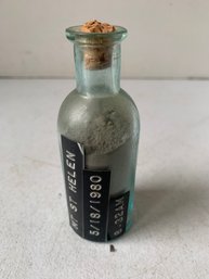 1980 AQUA BOTTLE WITH MT. ST. HELENS VOLCANIC ASH