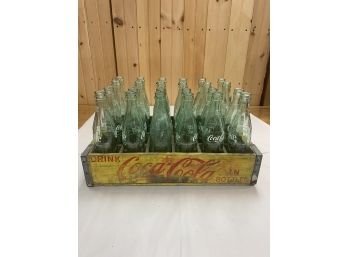 COCA COLA CASE WITH 24 10 OZ BOTTLES