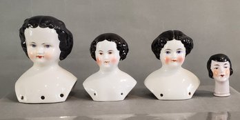 LOT OF 4 BLACK HAIR CHINA DOLL HEADS