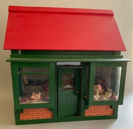 Tudor Style Red Roof Butcher Shop With 2 Front Display Windows And Assorted Contents