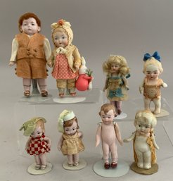 Lot Of 8 Small All Bisque Dolls, 2   4  Tall, Assorted Outfits