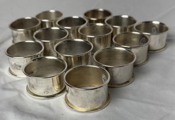Set Of Fourteen Silver Plate Napkin Rings