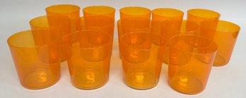 Fourteen Orange Glass Tumblers
