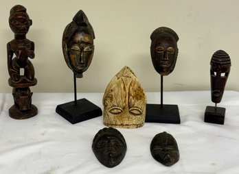 Seven African Carvings, Six Masks, One Figure